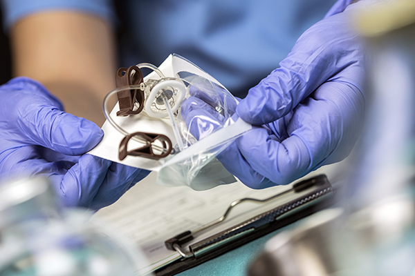 Nurse preparing venous catheters of long duration in a hospital